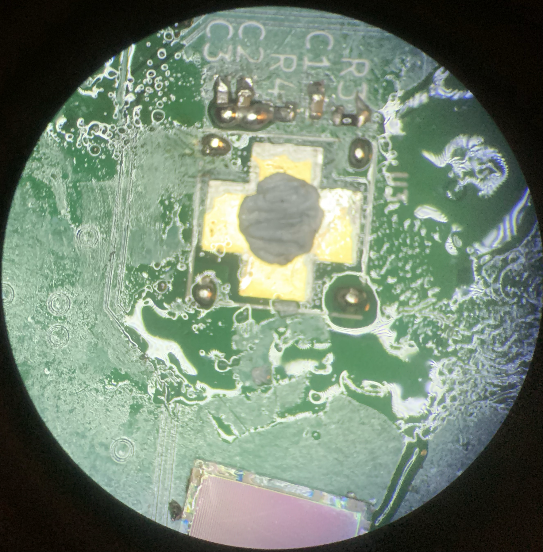 Microscope view of repair work around Mu's SiPM area