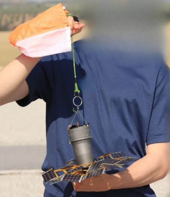 HoldingSpudnikSatellite